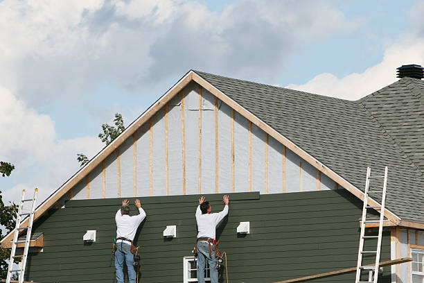 Professional Storm Damage Siding Repair technician working in Confluence, PA